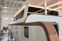 Modern Catamaran Ocean Beast 65, 2020 model, under construction in a well-lit facility.
