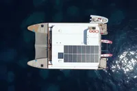 Aerial view of 2020 Catamaran Ocean Beast 65 with solar panels on calm water.