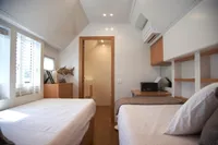 Interior of 2020 Catamaran Ocean Beast 65 with twin beds and modern decor.