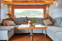 Luxurious interior of 2020 Catamaran Ocean Beast 65 with cozy seating and elegant decor.