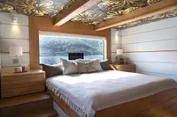 Luxurious bedroom in 2020 Catamaran Ocean Beast 65 with scenic ocean view.
