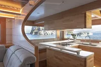 Luxurious interior of 2020 Catamaran Ocean Beast 65 with modern kitchen and ocean view.