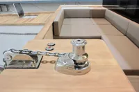 Anchor winch on Catamaran Ocean Beast 65, 2020 model, with beige seating area.