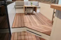 Luxurious Catamaran Ocean Beast 65 interior with wooden deck and seating area, 2020 model.