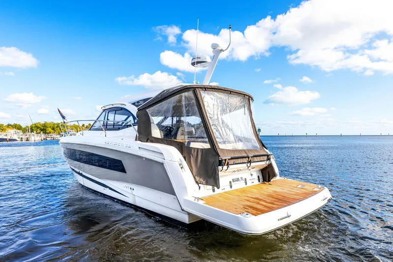  Yacht Photos Pics 2018 Jeanneau Leader 36 yacht on calm water under a clear blue sky.