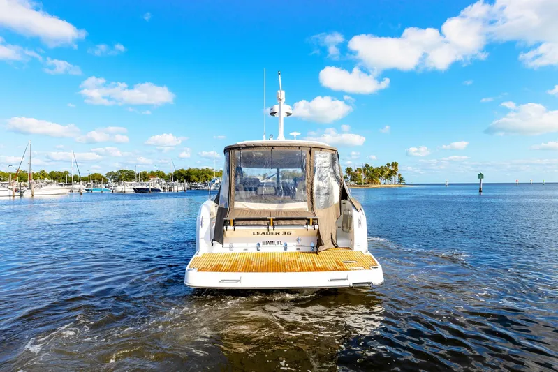  Yacht Photos Pics 2018 Jeanneau Leader 36 yacht cruising in a sunny marina.