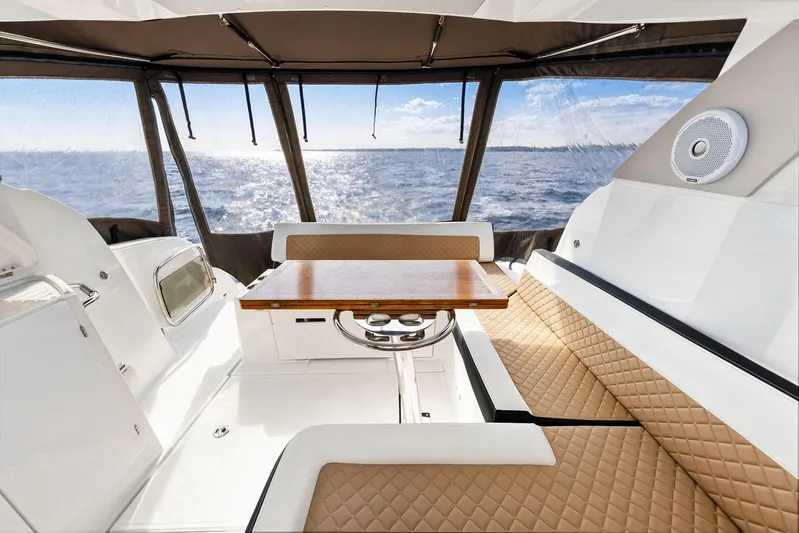  Yacht Photos Pics Interior of 2018 Jeanneau Leader 36 yacht with ocean view and elegant seating.
