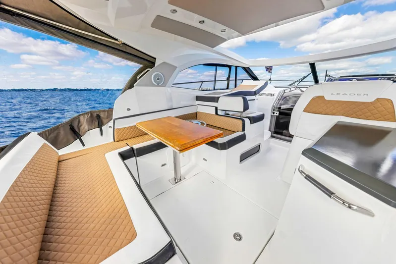  Yacht Photos Pics 2018 Jeanneau Leader 36 yacht interior with luxurious seating and ocean view.