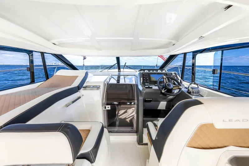  Yacht Photos Pics Interior of 2018 Jeanneau Leader 36 yacht with modern helm and seating.