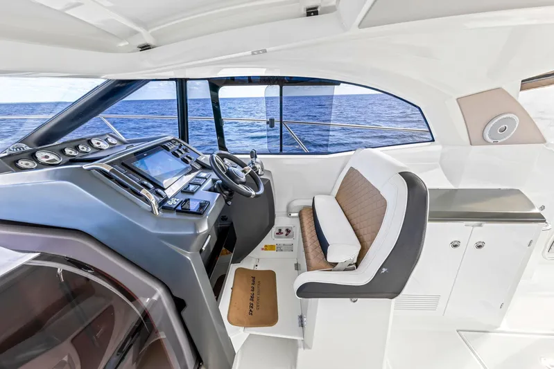  Yacht Photos Pics 2018 Jeanneau Leader 36 helm with modern controls and ocean view.