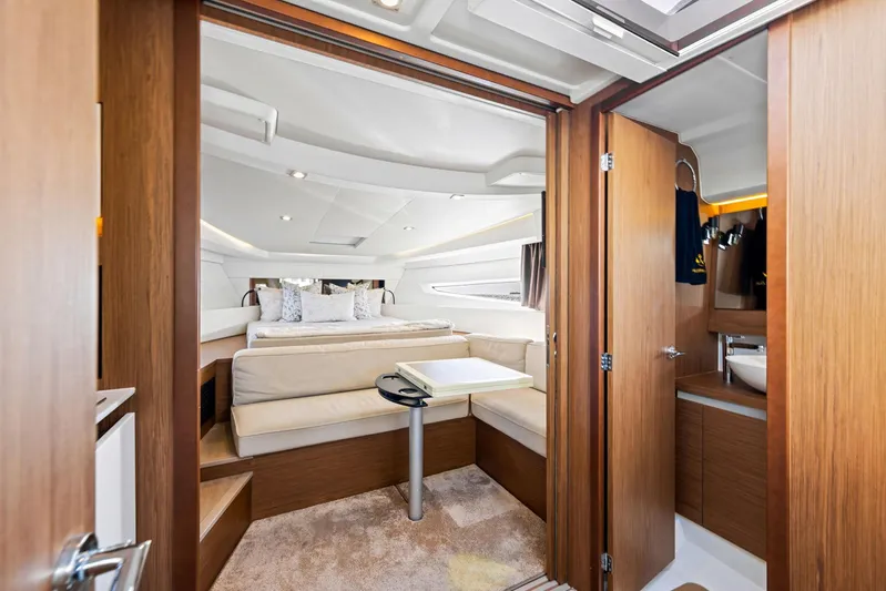  Yacht Photos Pics Luxurious interior of 2018 Jeanneau Leader 36 yacht with cozy seating and elegant wood finishes.