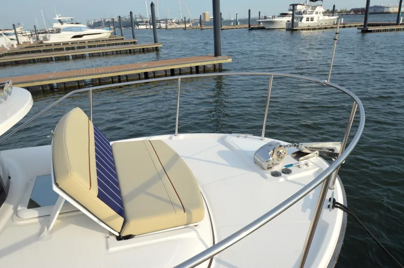 Chestnuts Yacht Photos Pics 2020 Ranger Tugs R-27 boat bow with seating, docked in a marina.
