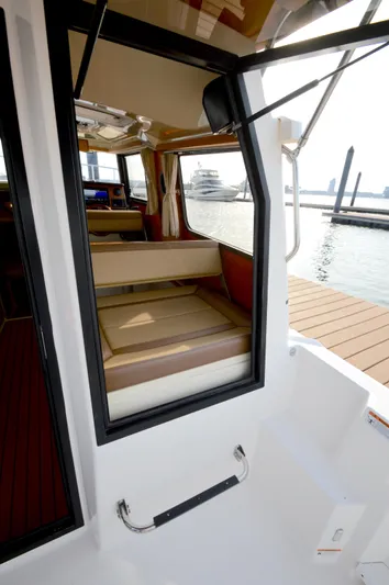Chestnuts Yacht Photos Pics 2020 Ranger Tugs R-27 interior view with dock and water in background.
