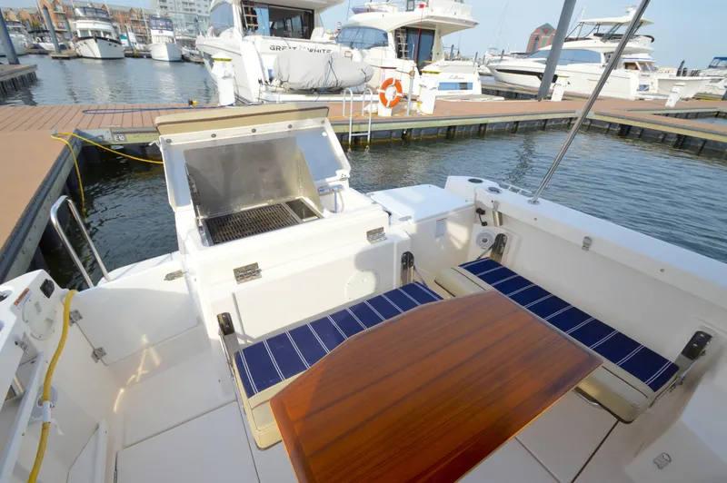 Chestnuts Yacht Photos Pics 2020 Ranger Tugs R-27 boat with outdoor seating and grill at marina.