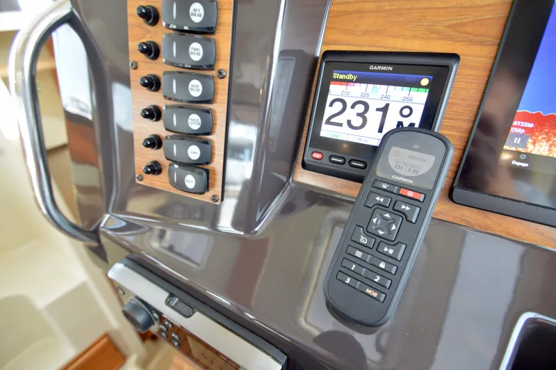 Chestnuts Yacht Photos Pics Control panel of 2020 Ranger Tugs R-27 with Garmin navigation system and remote.
