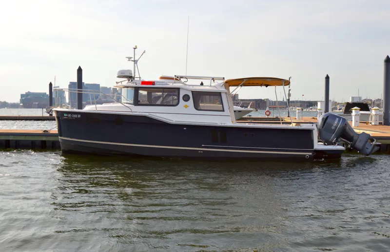 Chestnuts Yacht Photos Pics 2020 Ranger Tugs R-27 boat docked at a marina with outboard motor.