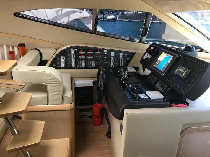  Yacht Photos Pics Interior cockpit of 2005 Ferretti Yachts 500, featuring navigation controls and seating.