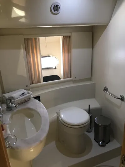  Yacht Photos Pics Bathroom interior of 2005 Ferretti Yachts 500, featuring sink, toilet, and mirror.