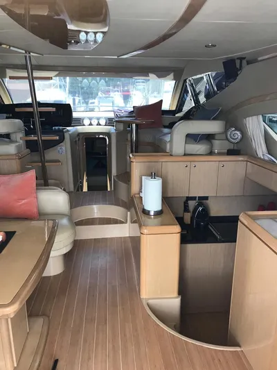  Yacht Photos Pics Interior of a 2005 Ferretti Yachts 500, featuring elegant wood finishes and modern design.