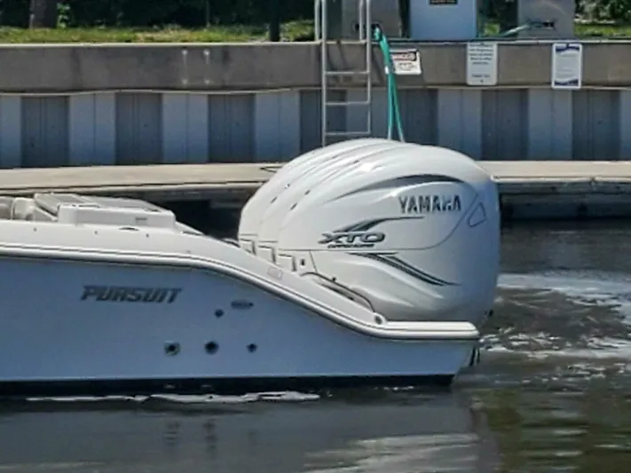 Fiji Kai Yacht Photos Pics 2023 Pursuit S378 boat with Yamaha XTO engine docked at marina.
