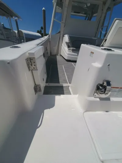 Fiji Kai Yacht Photos Pics 2023 Pursuit S378 boat interior with sleek white design and modern seating.