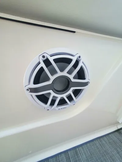 Fiji Kai Yacht Photos Pics 2023 Pursuit S378 boat speaker with white grille on interior panel.