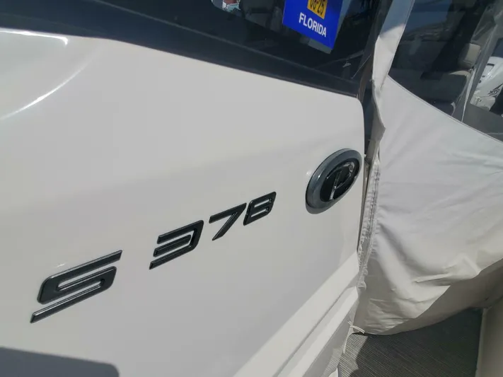 Fiji Kai Yacht Photos Pics 2023 Pursuit S378 boat with Florida registration, partially covered.