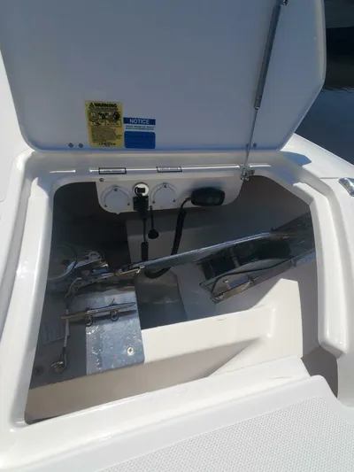 Fiji Kai Yacht Photos Pics 2023 Pursuit S378 boat anchor compartment with open hatch, showcasing anchor and chain storage.