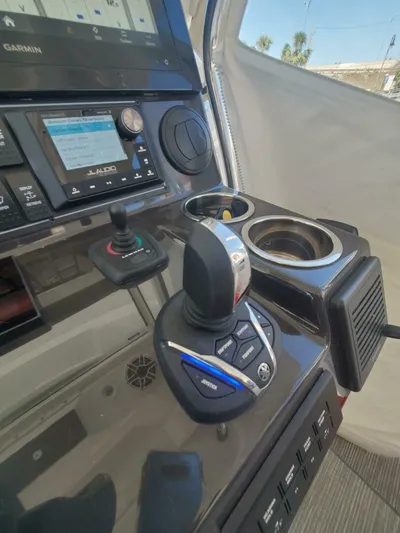 Fiji Kai Yacht Photos Pics Control panel of 2023 Pursuit S378 boat with joystick and navigation display.