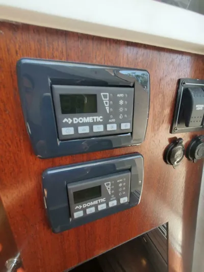 Fiji Kai Yacht Photos Pics Control panels on a 2023 Pursuit S378 boat, featuring Dometic systems.
