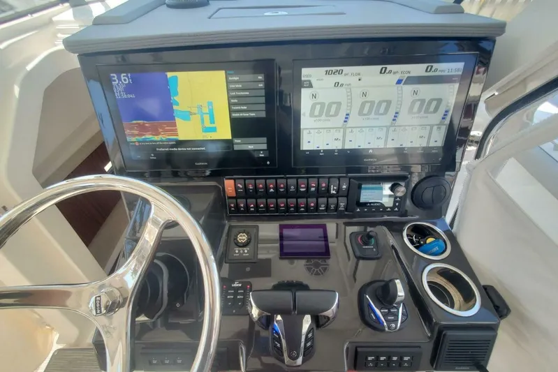 Fiji Kai Yacht Photos Pics 2023 Pursuit S378 boat dashboard with advanced navigation and control systems.