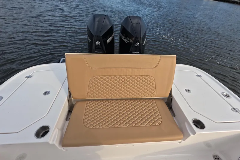  Yacht Photos Pics 2024 Caymas 281 HB boat with tan quilted seating and dual Mercury engines.