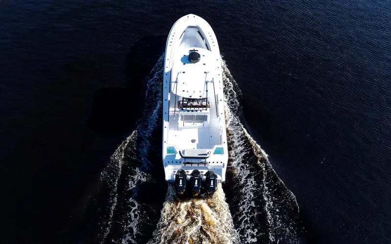  Yacht Photos Pics Aerial view of 2026 Front Runner 36 Center Console boat cruising on water.