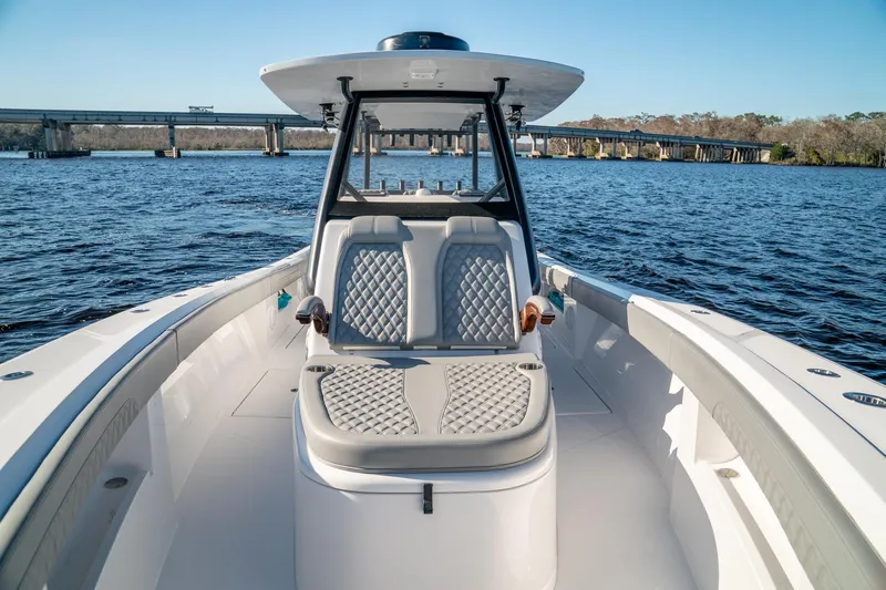  Yacht Photos Pics 2026 Front Runner 36 Center Console boat on water, featuring sleek design and comfortable seating.