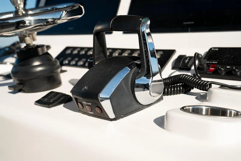  Yacht Photos Pics Control panel of 2026 Front Runner 36 Center Console boat with throttle and navigation equipment.