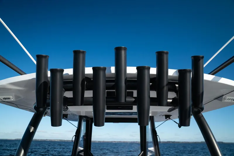  Yacht Photos Pics 2026 Front Runner 36 Center Console boat with rod holders against clear blue sky.