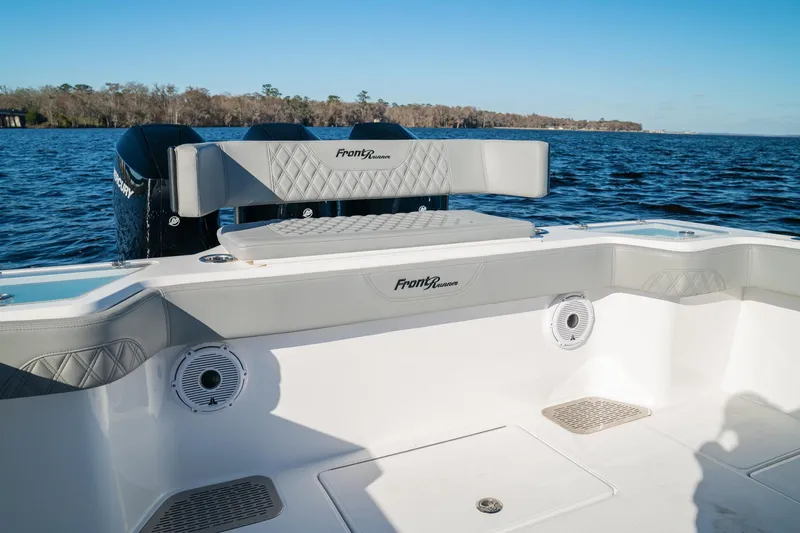  Yacht Photos Pics 2026 Front Runner 36 Center Console boat interior with seating, speakers, and ocean view.