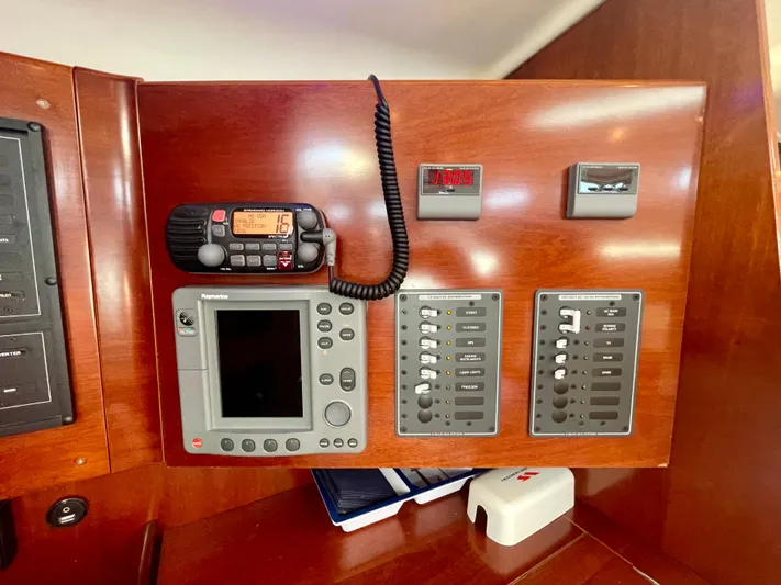Caravan Yacht Photos Pics Control panel of a 2002 Beneteau First 47.7 yacht with navigation and communication equipment.
