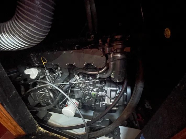 Caravan Yacht Photos Pics Engine compartment of a 2002 Beneteau First 47.7 sailboat, showcasing mechanical components.