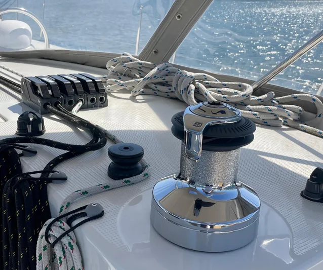 Caravan Yacht Photos Pics Deck of 2002 Beneteau First 47.7 sailboat with winch and ropes.