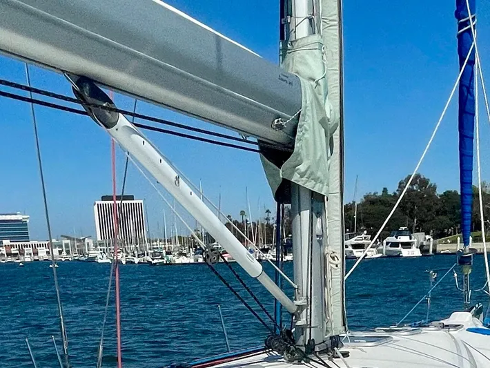 Caravan Yacht Photos Pics Beneteau First 47.7 sailboat mast and rigging, 2002 model, docked in a marina.