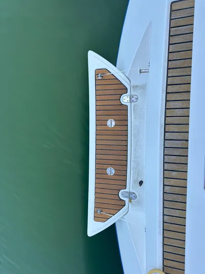 Caravan Yacht Photos Pics Beneteau First 47.7 yacht deck, 2002 model, featuring teak wood finish.