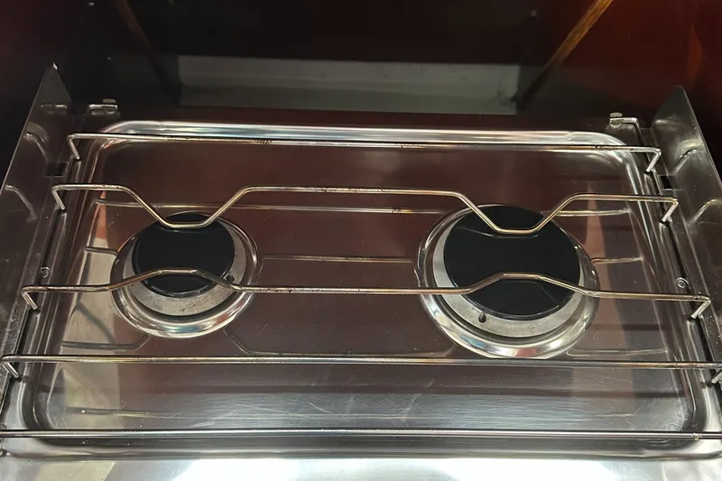 Caravan Yacht Photos Pics Stainless steel two-burner stove on a 2002 Beneteau First 47.7 yacht.