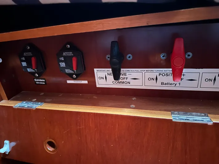 Caravan Yacht Photos Pics Electrical panel of a 2002 Beneteau First 47.7 sailboat with battery switches.