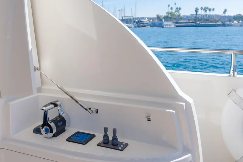 Fine Seas-onings Yacht Photos Pics Control panel on 2018 Marquis 720 Fly yacht, overlooking marina and blue water.