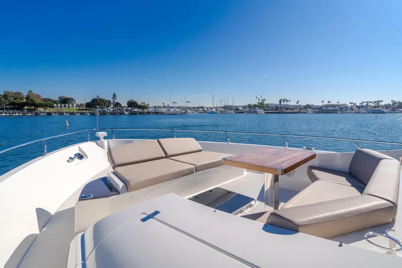 Fine Seas-onings Yacht Photos Pics Luxurious 2018 Marquis 720 Fly yacht with spacious deck seating and scenic ocean view.