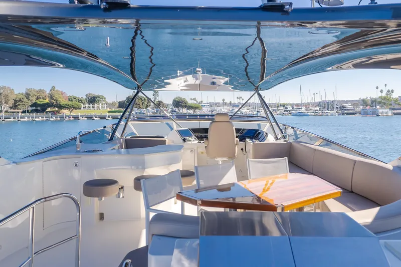 Fine Seas-onings Yacht Photos Pics Luxurious 2018 Marquis 720 Fly yacht interior with elegant seating and scenic marina view.