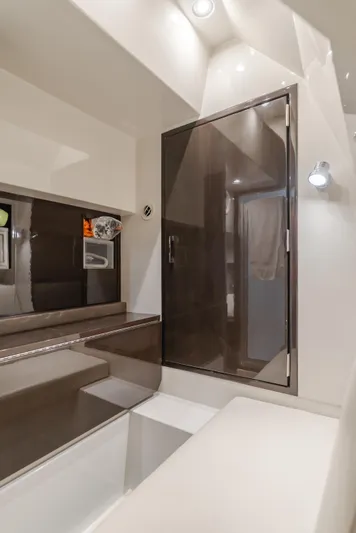 Fine Seas-onings Yacht Photos Pics Luxurious bathroom interior of 2018 Marquis 720 Fly yacht with modern design and sleek finishes.