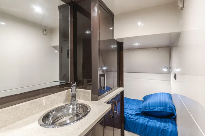 Fine Seas-onings Yacht Photos Pics Luxurious interior of 2018 Marquis 720 Fly yacht with modern sink and cozy bed.
