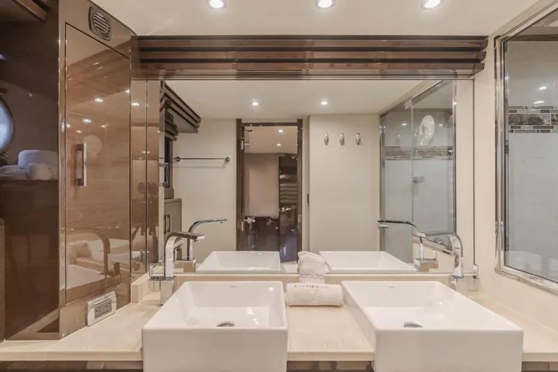 Fine Seas-onings Yacht Photos Pics Luxurious bathroom in 2018 Marquis 720 Fly yacht with dual sinks and modern fixtures.